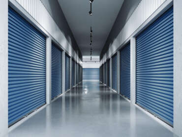 Storage facilities with blue doors. Interior units.